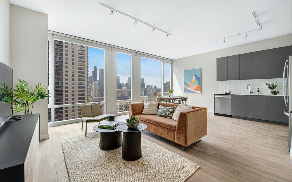 Living and Kitchen area, 23 west Apartments at One chicago. image courtesy of JDL