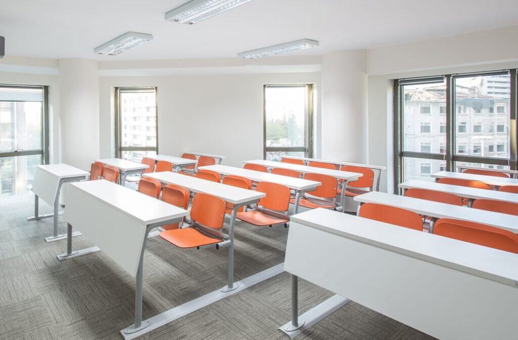 PVC edgebanding in solid white for educational lecture room setting. Image courtesy of RAMS Industries.