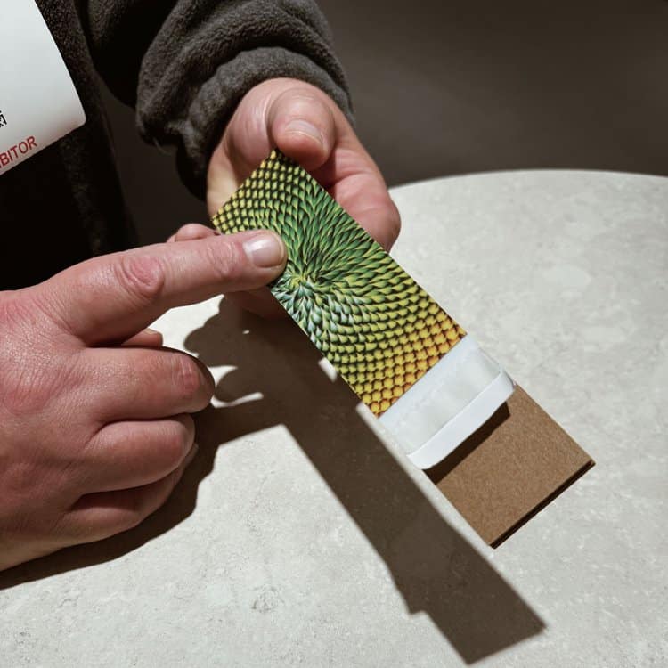 An exhibitor at CPSG shows a sample texture in a close-up.