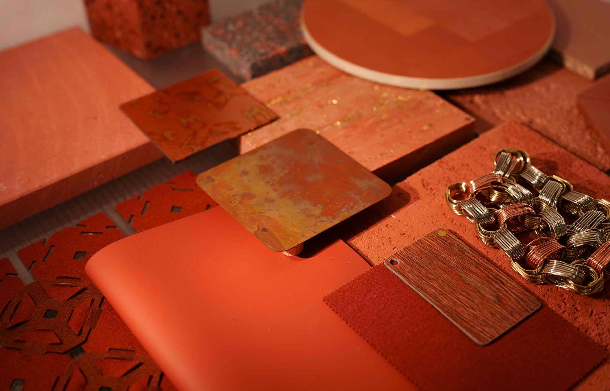 various materials and textures in warm orange red hues.