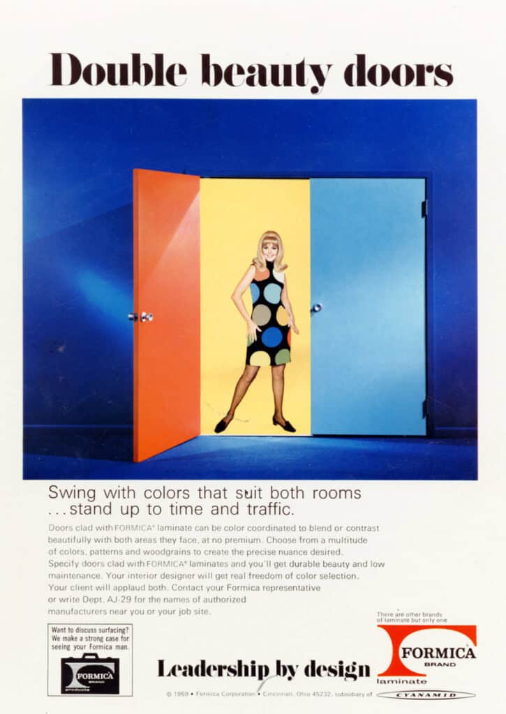 1969 Formica ad headlined "Double beauty doors." Against a blue background, a woman in a black shift dress with large multicolored polka dots stands in a doorway between two open doors — one orange, one light blue — with a yellow panel behind her. Copy reads "Swing with colors that suit both rooms… stand up to time and traffic," promoting color-coordinated laminate-clad doors. Footer reads "Leadership by design" with the Formica brand logo and Cyanamid subsidiary line.