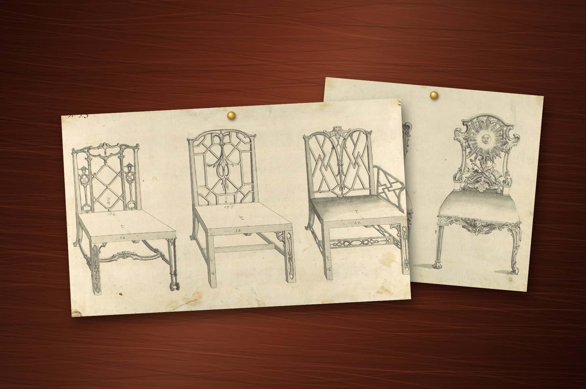 Two of Thomas Chippendale's original ink-and-wash chair designs, one Chinese and one Gothic, pinned to a polished mahogany surface
